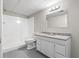 Functional bathroom with a shower, toilet, vanity, and a granite countertop sink at 9438 Cedar Creek Pl, Douglasville, GA 30135