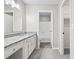 Updated bathroom showcasing a granite countertop, a shower/tub and tile flooring at 9438 Cedar Creek Pl, Douglasville, GA 30135