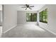 Bright bedroom with natural light, hardwood floors, and neutral walls at 9438 Cedar Creek Pl, Douglasville, GA 30135