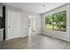 Eat-in kitchen featuring vinyl floors, natural light, and updated doors at 9438 Cedar Creek Pl, Douglasville, GA 30135
