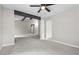 Large living area with exposed beams, natural light, and neutral paint at 9438 Cedar Creek Pl, Douglasville, GA 30135