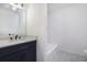 Bathroom featuring black hardware, modern vanity and countertops plus decorative tile floors at 170 Gilreath Nw Rd, Cartersville, GA 30121