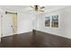 Bedroom with dark hardwood floors, ceiling fan and sliding barn door entrance at 170 Gilreath Nw Rd, Cartersville, GA 30121