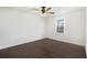 Neutral bedroom features ceiling fan, window and wood floors; freshly painted white at 170 Gilreath Nw Rd, Cartersville, GA 30121