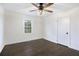 Bedroom offers hardwood floors, natural light, a ceiling fan, and fresh, neutral paint at 170 Gilreath Nw Rd, Cartersville, GA 30121