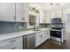 Kitchen area features new stainless steel dishwasher, microwave, and solid countertops at 170 Gilreath Nw Rd, Cartersville, GA 30121