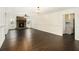 Large living room with wood floors, a stone fireplace, and views into the kitchen at 170 Gilreath Nw Rd, Cartersville, GA 30121