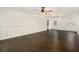 Open-concept living room with wood flooring, white walls, and natural light at 170 Gilreath Nw Rd, Cartersville, GA 30121