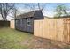 Backyard shed offering additional storage and accented by a wooden fence at 170 Gilreath Nw Rd, Cartersville, GA 30121