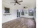 Inviting sunroom with lots of windows, wood flooring, and access to the backyard at 170 Gilreath Nw Rd, Cartersville, GA 30121