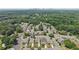 An aerial view of a quiet neighborhood showing tidy lawns, mature trees, and close proximity to a metropolitan area at 1840 Brighton Se Blvd, Atlanta, GA 30316