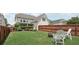 Well-maintained backyard with lush lawn, privacy fence, and inviting seating area with a fire pit at 1840 Brighton Se Blvd, Atlanta, GA 30316
