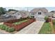 Aerial view of a fenced backyard featuring a well-maintained lawn, a two-car garage, and beautiful landscaping at 1840 Brighton Se Blvd, Atlanta, GA 30316