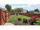 Fenced backyard featuring lush grass, landscaping, and a fire pit with seating creating a great outdoor space at 1840 Brighton Se Blvd, Atlanta, GA 30316