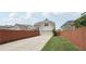 Fenced backyard featuring green space and two-car rear entry garage at 1840 Brighton Se Blvd, Atlanta, GA 30316