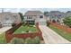 The backyard has a two-car garage, nice lawn, landscaping, and is surrounded by a tall wooden privacy fence at 1840 Brighton Se Blvd, Atlanta, GA 30316