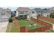 Aerial view of a fenced backyard with a well-maintained lawn, landscaping, and a two-car garage at 1840 Brighton Se Blvd, Atlanta, GA 30316