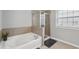 Bathroom featuring a garden tub and glass shower at 1840 Brighton Se Blvd, Atlanta, GA 30316