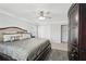 A bright bedroom with a large bed, soft gray rug, and a dark wood cabinet with drawers at 1840 Brighton Se Blvd, Atlanta, GA 30316