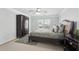 This bedroom has dark wood furnishings, a plush rug, and is brightly lit by a ceiling fan at 1840 Brighton Se Blvd, Atlanta, GA 30316
