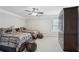 Bedroom has twin beds with neutral walls, a ceiling fan, and a dark wood armoire at 1840 Brighton Se Blvd, Atlanta, GA 30316