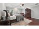 Spacious bedroom featuring tray ceiling, hardwood floors, and dark wood furniture at 1840 Brighton Se Blvd, Atlanta, GA 30316