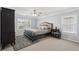 Bedroom featuring carpet, ceiling fan, and dark wood furniture at 1840 Brighton Se Blvd, Atlanta, GA 30316