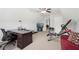 Spacious bonus room featuring a workspace, fitness equipment, and a mounted television at 1840 Brighton Se Blvd, Atlanta, GA 30316