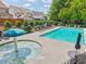 Relaxing community pool featuring lounge chairs and a mushroom water feature on a sunny day at 1840 Brighton Se Blvd, Atlanta, GA 30316