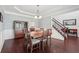 Open concept dining room with hardwood floors, staircase, and elegant chandelier at 1840 Brighton Se Blvd, Atlanta, GA 30316