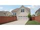 Back exterior and fenced yard with attached two-car garage at 1840 Brighton Se Blvd, Atlanta, GA 30316