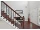 Bright foyer with hardwood floors, staircase, bench and door at 1840 Brighton Se Blvd, Atlanta, GA 30316