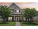 Charming two-story home with a brick facade, manicured lawn, and mature trees providing shade and curb appeal at 1840 Brighton Se Blvd, Atlanta, GA 30316