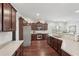 Open kitchen with dark wood cabinetry, stainless steel appliances, and tile backsplash at 1840 Brighton Se Blvd, Atlanta, GA 30316