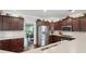 Well-equipped kitchen with stainless steel appliances, dark wood cabinets, and tile backsplash at 1840 Brighton Se Blvd, Atlanta, GA 30316