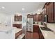 Bright kitchen with stainless steel appliances, dark cabinetry, and granite countertops at 1840 Brighton Se Blvd, Atlanta, GA 30316