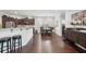 Open living area with hardwood floors adjacent to kitchen with stainless steel appliances and dining area at 1840 Brighton Se Blvd, Atlanta, GA 30316