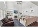 Open living room with fireplace, built-in bookshelves, and large windows providing natural light at 1840 Brighton Se Blvd, Atlanta, GA 30316