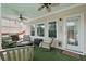 Cozy covered patio featuring outdoor seating, ceiling fans and convenient access to the backyard at 1840 Brighton Se Blvd, Atlanta, GA 30316