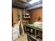 This basement workshop provides ample space for hobbies and storage, with a sturdy workbench and shelving at 2700 Regency E Dr, Tucker, GA 30084