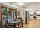 Open concept kitchen with breakfast nook features stainless steel appliances and adjacent to a sunroom at 2700 Regency E Dr, Tucker, GA 30084