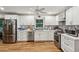 Modern kitchen with white cabinets, stainless steel appliances, and beautiful backsplash at 2700 Regency E Dr, Tucker, GA 30084
