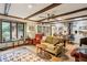 Bright living room with a decorative rug, wood beams, and a cozy seating area at 2700 Regency E Dr, Tucker, GA 30084