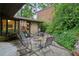 Outdoor patio area with comfortable seating surrounded by beautiful greenery at 2700 Regency E Dr, Tucker, GA 30084