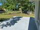 Backyard features a concrete patio area and green grass at 2875 Carriage Ln, Atlanta, GA 30349