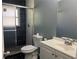 Updated bathroom with sleek tile, modern fixtures, and a glass-enclosed shower for a spa-like experience at 2875 Carriage Ln, Atlanta, GA 30349
