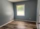 Comfortable bedroom with new floors and a sunlit window, ideal for a relaxing and restful environment at 2875 Carriage Ln, Atlanta, GA 30349