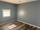 Cozy bedroom with new floors and a bright window, providing a comfortable and serene living space at 2875 Carriage Ln, Atlanta, GA 30349