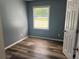Bright bedroom with a large window and new floors, creating a comfortable and airy retreat at 2875 Carriage Ln, Atlanta, GA 30349