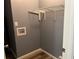 Small laundry room featuring gray walls, and shelf storage at 2875 Carriage Ln, Atlanta, GA 30349